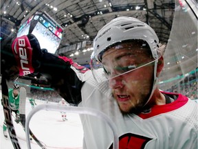 Erik Brannstrom #26 of the Ottawa Senators is checked into the glass by Corey Perry #10 of the Dallas Stars in the first period at American Airlines Center on October 21, 2019 in Dallas, Texas.