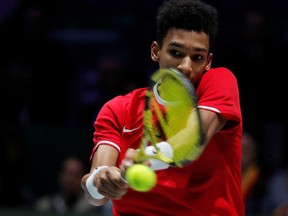 Canada's Felix Auger-Aliassime in action during his match against Spain's Roberto Bautista Agut at the Davis Cup finals, Nov. 24, 2019. (REUTERS/Susana Vera)