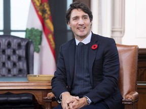 Prime Minister Justin Trudeau smiles as he makes his opening remarks before a meeting with P.E.I. Premier Dennis King in his office on Parliament Hill in Ottawa, Thursday November 7, 2019. THE CANADIAN PRESS/Adrian Wyld