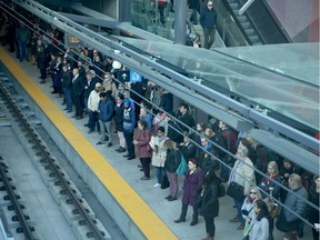 A lineup of commuters at the Tunney's Pasture LRT station.