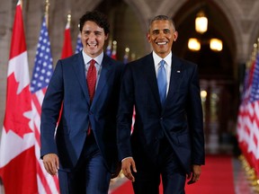 Prime Minister Justin Trudeau and then-U.S. president Barack Obama walk together in a file photo. Obama, on Oct. 16, 2019, urged Canadian voters to back Trudeau for another term.