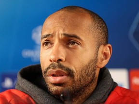 Monaco coach Thierry Henry speaks during a news conference in Monaco on the eve of the UEFA Champions League football match between AS Monaco and Dortmund in Monaco on Nov. 14, 2019.