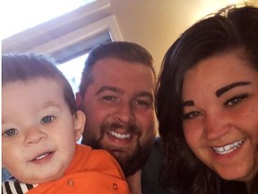 Lee Tappenden, centre, his wife Amy, right, and their son Anthony pose in this undated handout photo.