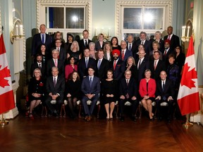 Prime Minister Justin Trudeau and Gov. Gen. Julie Payette pose with the new ministers after the presentation of Trudeau's new cabinet at Rideau Hall on Nov. 20, 2019.