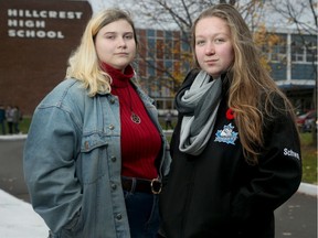 Grade 11 students Maizie Schwets, 16, , left and Diane Hatheway, 15, say the current dress code's ban on 'revealing' clothing seems aimed at girls.