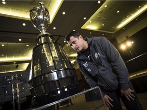 Winnipeg Blue Bombers quarterback Zach Collaros checks out the Grey Cup in advance of Sunday's CFL championship game against the Hamilton Tiger-Cats.