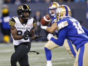Hamilton Tiger-Cats' Bralon Addison (86) catches a pass against the Winnipeg Blue Bombers during the first half of CFL action in Winnipeg on Friday, September 27, 2019.