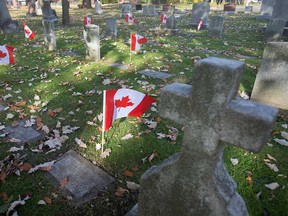 Canadian flags at the graves of First World War veterans in Windsor Grove Cemetery on Nov. 5, 2019. Members of the WIndsor Veterans Memorial Services Committee say 160 flags were recently stolen from the cemetery.