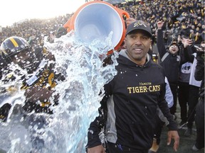 Tiger-Cats head coach Orlondo Steinauer gets doused with ice water water after his team defeated the Eskimos  during the CFL Eastern Conference final on Sunday.