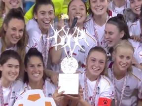 University of Ottawa Gee-Gees players with the championship trophy in China on Saturday.