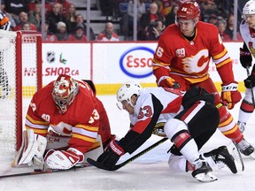 Calgary Flames goalie David Rittich stops a shot from Ottawa Senators right-winger Tyler Ennis during the first period at Scotiabank Saddledome.