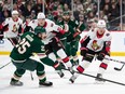 The Ottawa Senators' Filip Chlapik (78) and Minnesota Wild defenceman Jonas Brodin (25) fight for the puck during the first period at Xcel Energy Center.