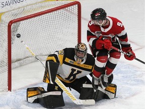 Kingston Frontenacs goaltender Ryan Dugas gets screened by Ottawa 67's Austen Keating on a shot from Marco Rossi during Ontario Hockey League action at the Leon's Centre in Kingston on Wednesday November 27, 2019.