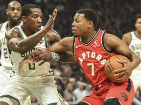 Raptors guard Kyle Lowry (right) drives for the basket against Bucks guard Eric Bledsoe (left) in first quarter NBA action at Fiserv Forum in Milwaukee, on Saturday, Nov. 2, 2019.