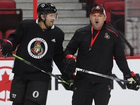 Ottawa Senators coach D.J. Smith with veteran Ron Hainsey