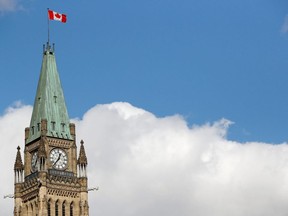 The Canadian flag on the Peace Tower flies in Ottawa, on Oct. 23, 2019.