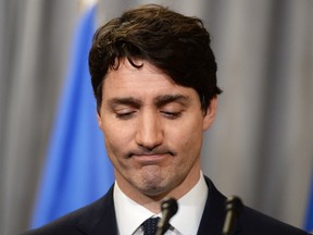 Prime Minister Justin Trudeau pauses after delivering an official apology to Inuit for the federal government's management of tuberculosis in the Arctic from the 1940s to the 1960s during an event in Iqaluit, Nunavut on Friday, March 8, 2019. (THE CANADIAN PRESS/Sean Kilpatrick)