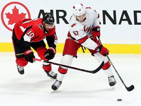 Senator player Anthony Duclair battles for the puck with Trevor van Riemsdyk in second period action as the Ottawa Senators take on the Carolina Hurricanes in NHL action at the Canadian Tire Centre in Ottawa.