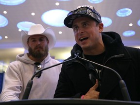 Winnipeg Blue Bombers quarterbacks Zach Collaros (right) and Chris Streveler take turns addressing fans at a podium at Winnipeg James Armstrong Richardson International Airport on Mon., Nov. 25, 2019 after the team came home from Calgary with the Grey Cup. Kevin King/Winnipeg Sun/Postmedia Network