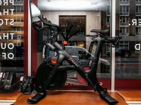 A Peloton stationary bike sits on display at one of the fitness company's studios on December 4, 2019 in New York City.
