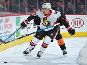 Tyler Ennis of the Ottawa Senators fights off a Philadelphia Flyers defender in the first period at Wells Fargo Center on Saturday, Dec. 7, 2019.