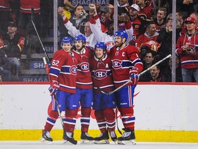 The Canadiens’ Brendan Gallagher celebrates with his teammates after scoring goal against the Calgary Flames during NHL game at the Scotiabank Saddledome on Dec. 19, 2019.