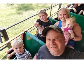 Jack Moon sits with his son, Nathaniel, beside him. Behind, Moon's fiancee, Krystiannah Summers, sits beside son Dominic and holds their daughter, Kaedence. Krystiannah is pregnant with a baby boy who is due in April. Jack Moon. 33, was killed Dec. 11 in a crash on Highway 401, east of Kingston. Source Family photo/GOFUNDME