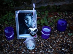 Tributes are seen outside the home of former singer George Michael after his sister, Melanie Panayiotou, 55, was found dead on Christmas Day, in London, Dec. 27, 2019. (REUTERS/Hannah McKay)