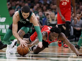 Toronto Raptors forward OG Anunoby, right, battles Boston Celtics forward Jayson Tatum for a loose ball during the second quarter at TD Garden in Boston, Dec. 28, 2019. (Winslow Townson-USA TODAY Sports)