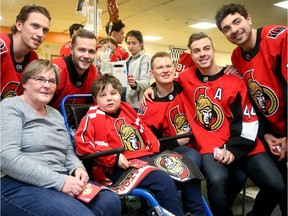 Nine-year-old Jacob Choueiri, 9, met some of his hockey heroes during the Senators' annual visit to CHEO earlier this month, including, left to right, Thomas Chabot, Cody Goloubef, Brady Tkachuk, Jean-Gabriel Pageau and Nick Paul.