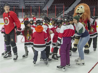 Brady Tkachuk leads a group of kids during the 16th annual Eugene Melnyk Skate for Kids at Canadian Tire Centre on Friday, Dec. 20.