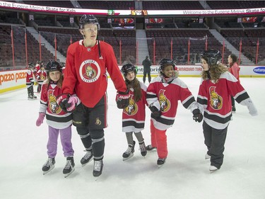 Brady Tkachuk leads a group of kids during the 16th annual Eugene Melnyk Skate for Kids at Canadian Tire Centre on Friday, Dec. 20.