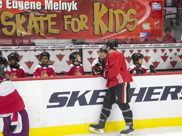 Jean-Gabriel Pageau chats with kids as they take part in the 16th annual Eugene Melnyk Skate for Kids at Canadian Tire Centre on Friday, Dec. 20.