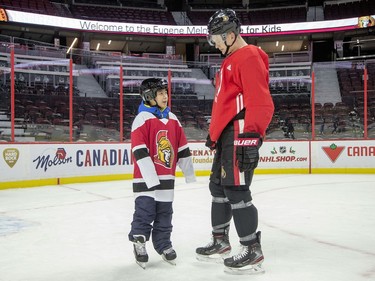 Brady Tkachuk chats with a youngster as Ottawa Senators owner Eugene Melnyk hosted over 100 children at the 16th annual Eugene Melnyk Skate for Kids at Canadian Tire Centre on Friday, Dec. 20.