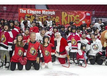 Ottawa Senators owner Eugene Melnyk (front left) hosted over 100 children at the 16th annual Eugene Melnyk Skate for Kids at Canadian Tire Centre on Friday, Dec. 20.