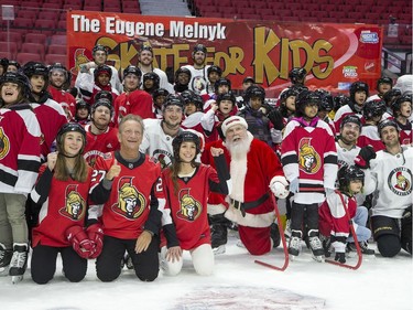 Ottawa Senators owner Eugene Melnyk (front left) hosted over 100 children at the 16th annual Eugene Melnyk Skate for Kids at Canadian Tire Centre on Friday, Dec. 20.
