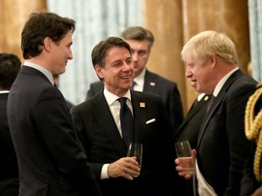 Britain's Prime Minister Boris Johnson (R) speaks with Canada's Prime Minister Justin Trudeau (L) and Italy's Prime Minister Giuseppe Conte at Buckingham Palace in central London on December 3, 2019, to attend reception hosted by Queen Elizabeth ahead of the NATO alliance summit. - (Photo by YUI MOK/POOL/AFP via Getty Images)