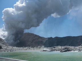 This handout photograph courtesy of Michael Schade shows the volcano on New Zealand's White Island spewing steam and ash minutes following an eruption on December 9, 2019. - New Zealand police said at least one person was killed and more fatalities were likely, after an island volcano popular with tourists erupted on December 9 leaving dozens stranded.