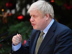 Britain's Prime Minister Boris Johnson delivers a speech outside 10 Downing Street in central London on December 13, 2019, following his Conservative party's general election victory.