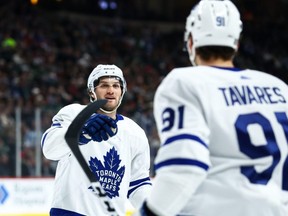 Maple Leafs centre Alexander Kerfoot (left) celebrates with centre John Tavares (right) after Kerfoot scored a goal against the Wild during first period NHL action at Xcel Energy Center in St. Paul, Minn., Tuesday, Dec. 31, 2019.