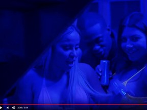 Marcella Zoia, aka Chair Girl, left, is seen in a screengrab from Drake's new video War.