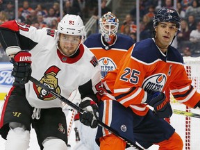 Ottawa Senators forward Artem Anisimov and Edmonton Oilers defencemen Darnell Nurse look for a loose puck during Wednesday's game at Rogers Place. Anisimov scored his first power-play goal as a Senator in the game.