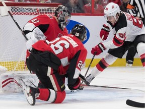 Ottawa Senators goalie Craig Anderson (41) makes a save on a shot from New Jersey Devils center Jack Hughes (86) in the first period at the Canadian Tire Centre.