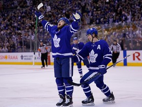 Toronto Maple Leafs forward Mitch Marner congratulates forward William Nylander (88) on his goal against the Carolina Hurricanes during the first period at Scotiabank Arena in Toronto on Monday.