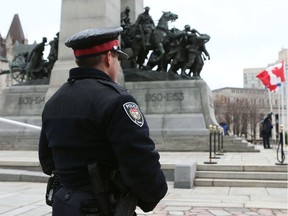 Ottawa police began guarding the National War Memorial after an attack by a gunman who killed Cpl. Nathan Cirillo.