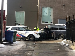 Investigators at the scene of a police-involved shooting near Queen and Spadina, on Sunday.