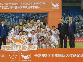 The University of Ottawa Gee-Gees women’s soccer team celebrates after winning the FISU University World Cup Football championship. FISU