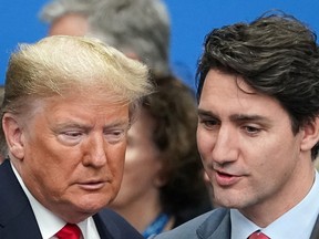 U.S. President Donald Trump talks with Prime Minister Justin Trudeau at the NATO summit in Watford, Britain, Dec. 4, 2019. (REUTERS/Kevin Lamarque)