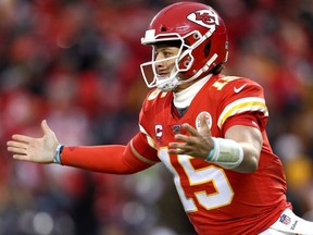 Patrick Mahomes of the Kansas City Chiefs celebrates an eight yard touchdown pass against the Houston Texans during the fourth quarter in the AFC Divisional playoff game at Arrowhead Stadium on Sunday in Kansas City, Missouri.