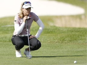Brooke Henderson looks over a putt on the 18th green during the second round of the Diamond Resorts Tournament of Champions at Tranquilo Golf Course at Four Seasons Golf and Sports Club Orlando on Jan. 17, 2020 in Lake Buena Vista, Fla.
